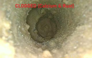 Borescope inspection showing severe calcium scale and rust clog inside injection mold cooling channel